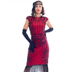 A close view of a Red Flapper Dress with a cocktail and deco pattern of red sequins and black beads.