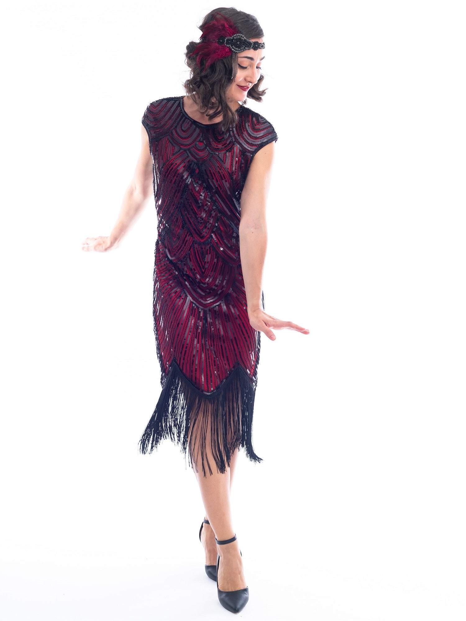 An action view of a vintage red 1920s Flapper Dress with black beads
