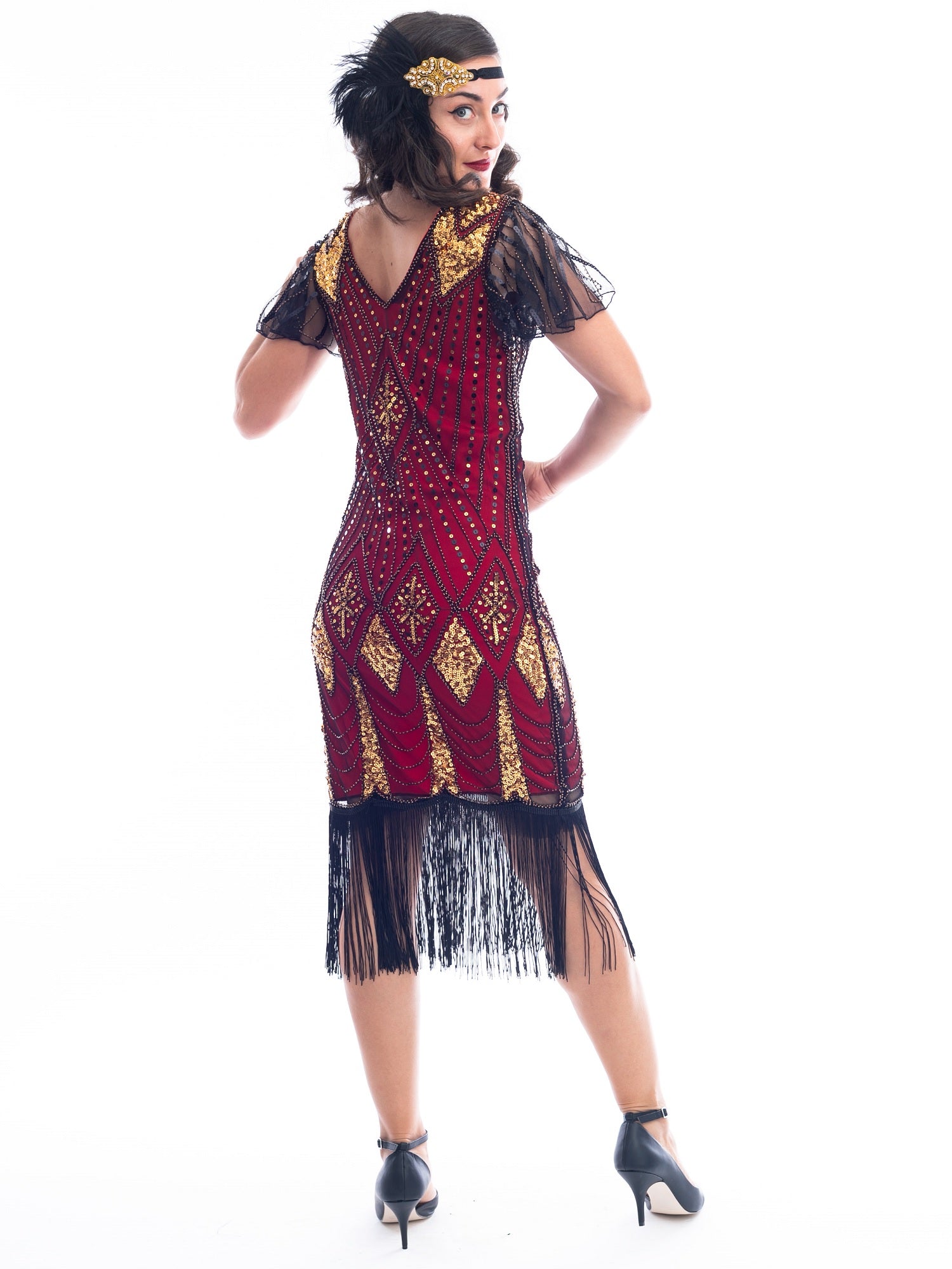 A back view of a vintage red 1920s Flapper Dress with gold beads & black sequins