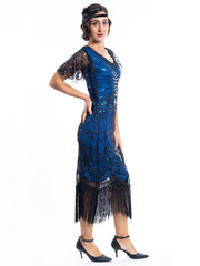 A blue gatsby dress with black beads and short sleeves