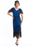 A blue gatsby dress with black beads and short sleeves